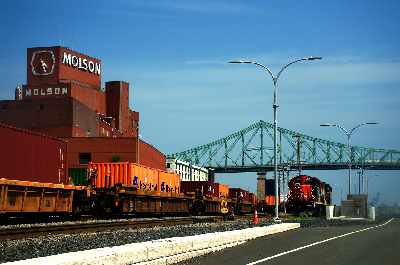 CN 500 is about to back onto its outbound train in the Port of Montreal. While the Molson sign is still visibile at left, they moved their operations to the South Shore a couple of years ago.