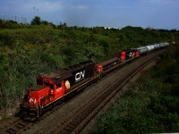 A hump set comprised of CN 6014, CN 247 & CN 5328 works the dual humps at MacMillan yard.