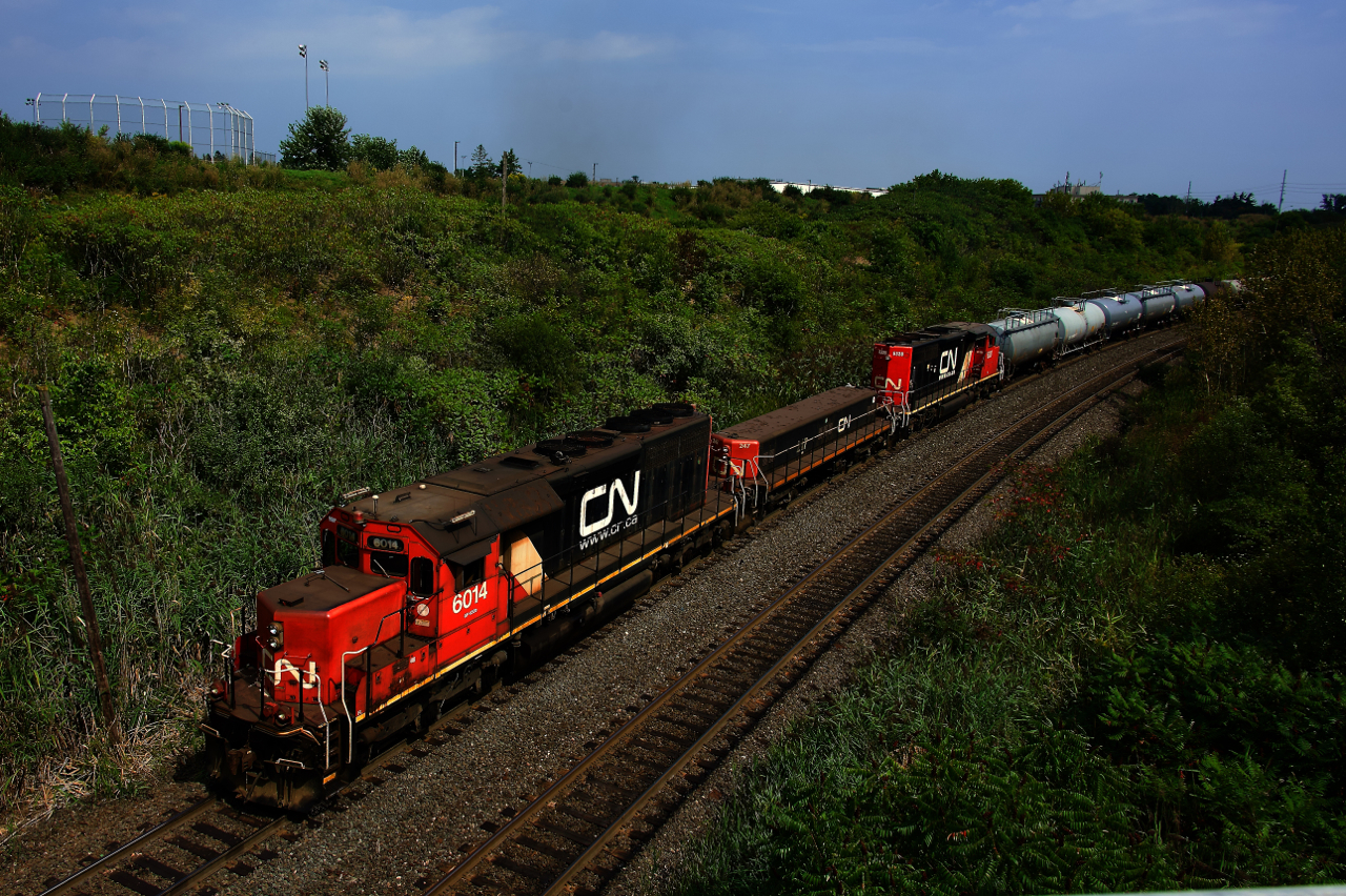 A hump set comprised of CN 6014, CN 247 & CN 5328 works the dual humps at MacMillan yard.