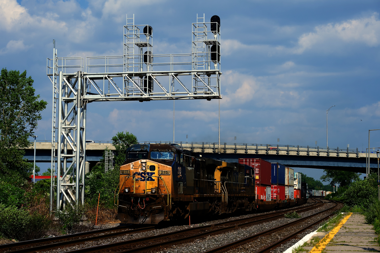 Getting rare these days, a pair of YN2 units leads CN 327 underneath a signal gantry at Dorval.