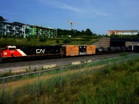 Still looking decently fresh, CN 3273 leads CN X309 away from Turcot Ouest after changing crews.