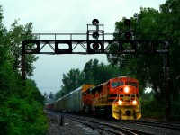 With the remnants of Hurricane Debby dumping what would total 153mm of rain on Montreal, QG 502 is leaving CPKC's St-Luc Yard on Friday. At left CPKC 133 lis lined to come back from the port. Power is ex-BNSF SD70MACs QGRY 4015 & QGRY 4021.