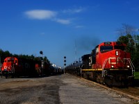 CN 538 is working the yard as CN 368 blasts by on the main line.