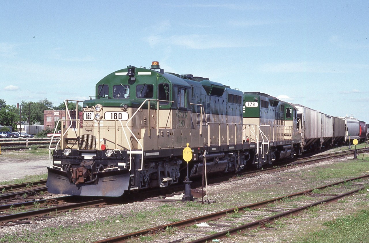 A scant two months after start-up, Goderich-Exeter train with units 180 and 179 is in the process of picking up traffic from CN at the yard in Stratford. Within the hour the Stratford turn will embark on its run back to the  base in Goderich.