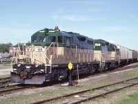  A scant two months after start-up, Goderich-Exeter train with units 180 and 179 is in the process of picking up traffic from CN at the yard in Stratford. Within the hour the Stratford turn will embark on its run back to the  base in Goderich.