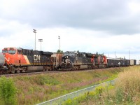 Eastbound (CN 3335 CN 2614) operating DP 2-1-0 is stopped on the North Track with the head-end at Tansley, DPU CN 2313 is opposite my location at Mile 44.8 as the westbound CN 3008 (IC Heritage) CN 3239 passes on the South Track.
 
