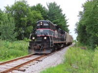 1001 approaches Ferndale drive in Barrie on its return to Utopia with two cars. The whistle sign on the right is one of many that have been replaced with CP style signs since the take over from CN in 1997.