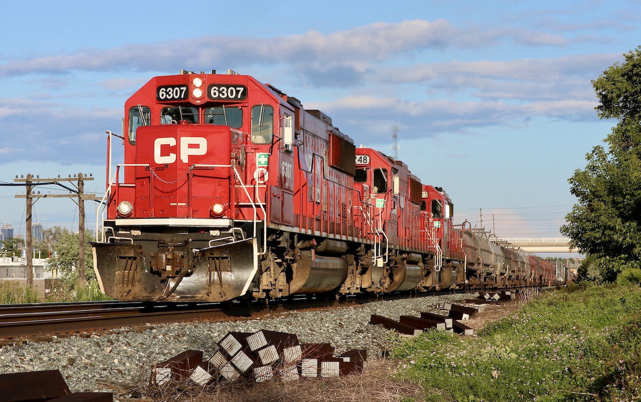 Hearing 236 has a pair of SD60’s was enough to put some effort in to catch it somewhere under decent light. Of course plans typically don’t work out, especially chasing CPKC lately. The sun angle away perfect at Hornby so we set off to catch it there. An hour later it was stopped at Erindale with its trailing GP38 not loading. We decided to head towards the train figuring the light would drop before the train actually arrived. By the time we neared Meadowvale 236 was reported on the move again so we had to quickly find a location. Minutes later 236 was caught struggling up the slight grade at Meadowvale. After 3/4 of the train passed the engineer flicked the switch to turn on the sanders only to find out he accidentally dropped all the air in the tail end of the train.  Stuck on the grade they were dead in the water with the second unit now failing. The train would spend the next several hours waiting for help. I’m sure the crew won’t forget this trip.