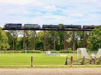 Field of dreams. I have to admit I’d have a problem staying focused playing soccer here, LOL. Years ago not just CN, but NS and its predecessors plied these rails. I’ve shot a few trains on this bridge over the years but this is the first time I have caught Gio Rail here. It’s unfortunately the Ford plant west of here is long gone as it provided several daily opportunities to photograph trains here. Today most trains caught on the bridge are simply using it for head room while they work the small CN yard to the east. Here LDS leased GP38 2003 and GP9U 1597 work their GIO Rail train  of solid tank cars before lifting 3 cars and heading back east. 