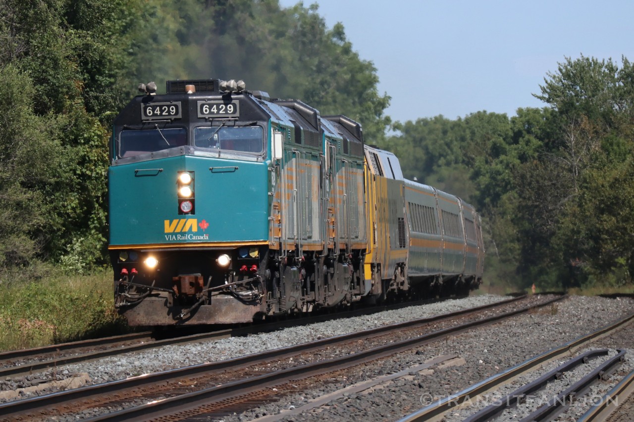 VIA 6429 leading VIA 063, VIA 6428 and VIA 903 trailing, 6 LRC coaches and VIA 6404 bringing up the tail end. At Eglinton GO Station.