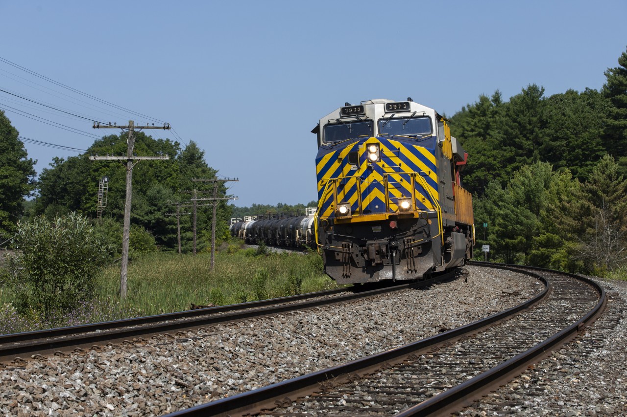 A former Citirail striped GEVO is on the point of a slow-moving M314 at South Parry, which is just around the corner from the south end of the directional running zone or 'DRZ' at Boyne, or 'Reynolds' on the CP.

M314 has already slowed for a temporary slow order a mile or so north of our location, and will ride it out for another mile or two before throttling back up and curving through Muskoka, bound for Mac Yard near Toronto.