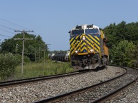 A former Citirail striped GEVO is on the point of a slow-moving M314 at South Parry, which is just around the corner from the south end of the directional running zone or 'DRZ' at Boyne, or 'Reynolds' on the CP.

M314 has already slowed for a temporary slow order a mile or so north of our location, and will ride it out for another mile or two before throttling back up and curving through Muskoka, bound for Mac Yard near Toronto.