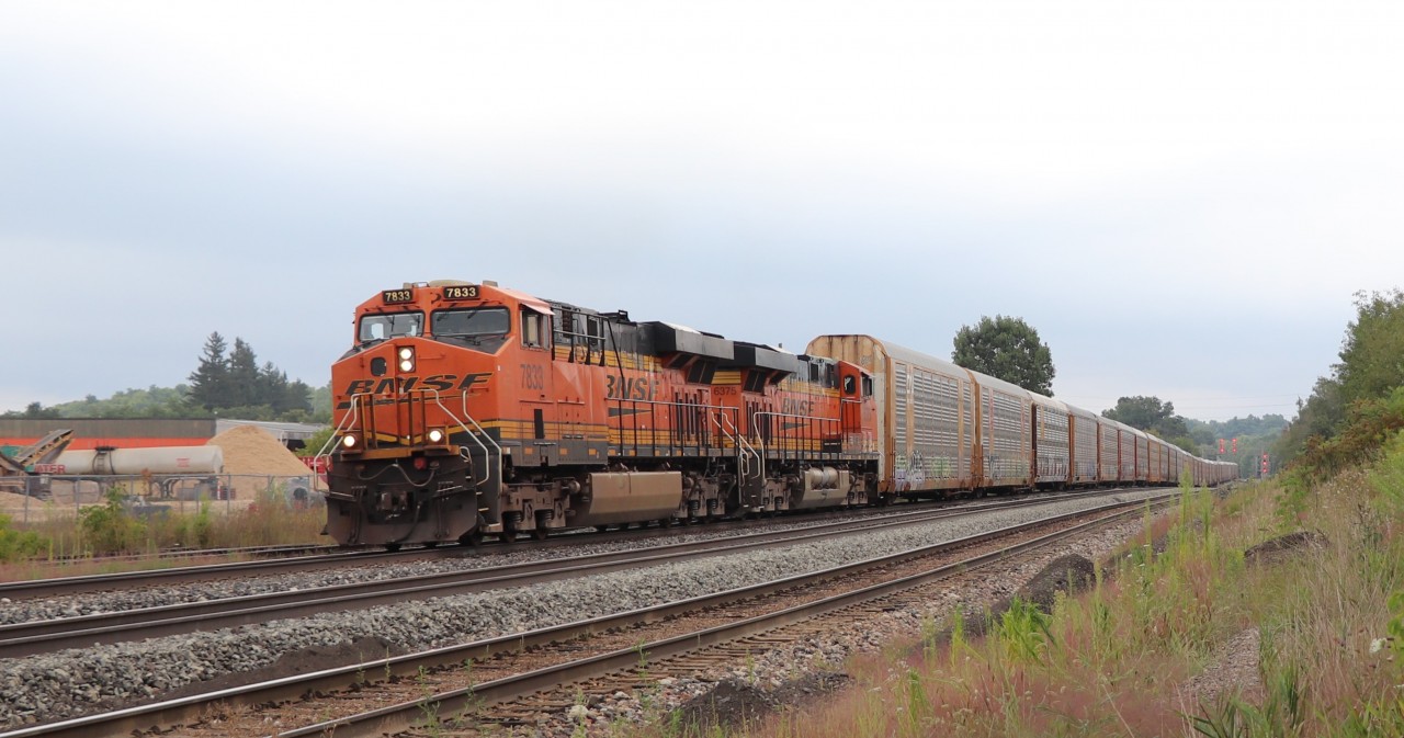 We got a text that CPKC 137 was on the way, so out we went to check out a location to photograph it. We went to Mountsberg first but the tall weeds had taken over and I wouldn't be able to shoot over them. Off we went to Guelph Junction to wait it out. We met another railfan who told us it was a double BNSF. He was correct. After a few minutes BNSF 7833 with BNSF 6375 slowly powered their way through Guelph Junction headed west.