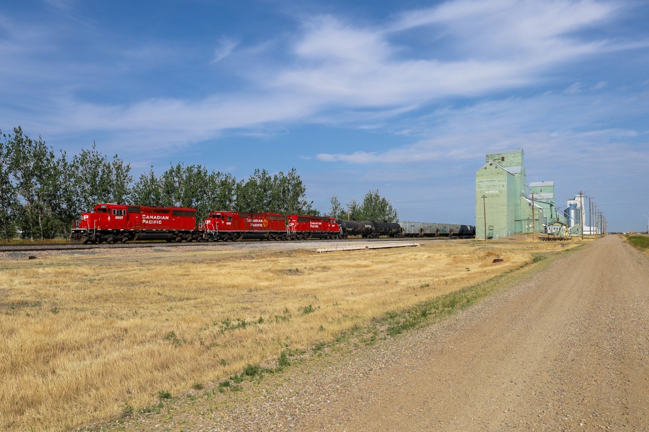 CPKC B08-30 rolls through Warner, Alberta on the Montana Sub.  The train operates daily from Lethbridge to Coutts, Alberta where they interchange with BNSF at Sweetgrass, Montana.  Power today was CP 5007, CP 6231 and CP 5036 with 58 cars.