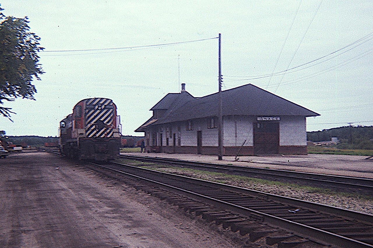 Going thru some old slides.  This shot is pretty rough, but it shows power and the station at Ignace 50 years ago this month, August 1974.
Anyone know what year the station came down?