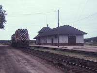 Going thru some old slides.  This shot is pretty rough, but it shows power and the station at Ignace 50 years ago this month, August 1974.
Anyone know what year the station came down?