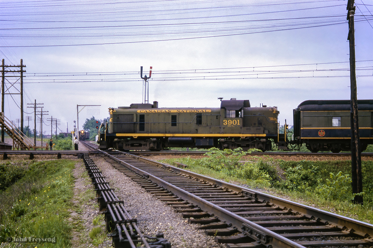 Train 82 from Grenville to Montreal behind ALCO RS3 3901 pounds the diamond with the St-Laurent Sub at E.J. Tower.  Per the CNRHA, this was one of two steam generator-equipped RS3s purchased for the Central Vermont in 1954 at CV 1859, 1860, later renumbered CV 3900, 3901 and finally transferred to the CNR in 1958.Scan and editing by Jacob Patterson.