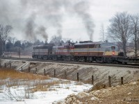 A going away shot of CP extra 4050 west just clear of First Line.  Moments before, the train had <a href=https://www.railpictures.ca/?attachment_id=54452>met extra 8027 west</a> who will follow behind shortly.<br><br><i>Scan and editing by Jacob Patterson.</i>