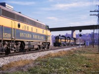 Toronto - North Bay train 459, led by F7s 1519, 1521, hold the main at the north end of Rosedale in the Don Valley while North Bay - Toronto train 452 behind RS3s 1300, 1311 takes the siding.<br><br><i>Scan and editing by Jacob Patterson.</i>