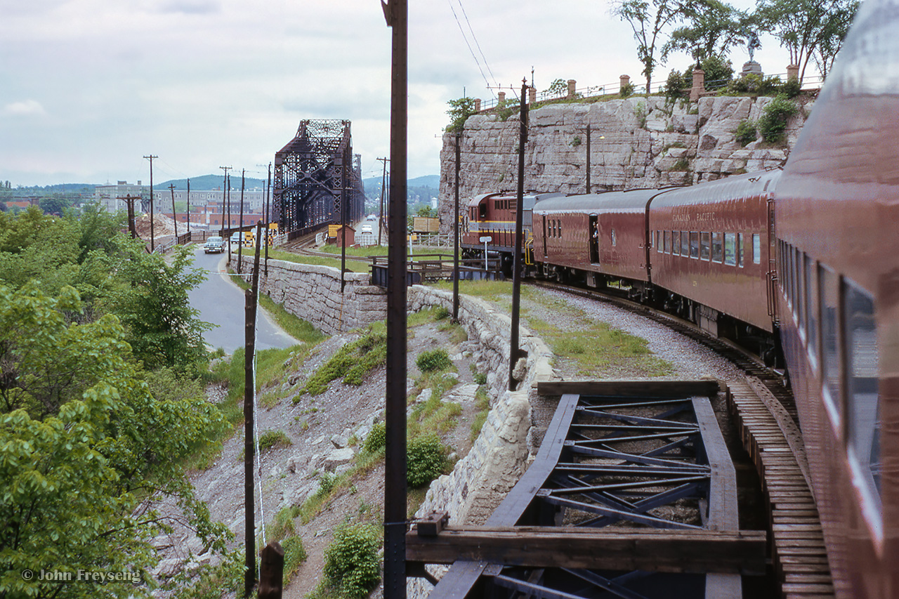 The 1965 NMRA convention excursion from Ottawa to Wakefield heads towards the Alexandra Bridge over the Rideau Canal.Scan and editing by Jacob Patterson.