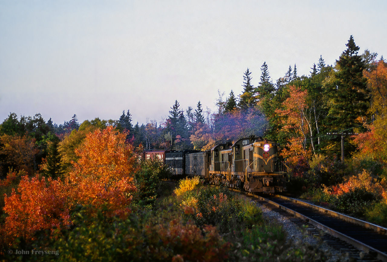 Tri-weekly Yarmouth - Halifax mixed train M244 behind a pair of MLW RSC13s approaches East River. Around two hours remains of the eleven-hour journey.

Scan and editing by Jacob Patterson.