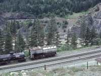 <br>
<br>
For those in the West / and who follow same
<br>
<br>
Summer season has Fire Fighting top of mind
<br>
<br>
two CN water canteens spotted on the back track near the Cisco bridges.
<br>
<br>
Near Lytton, May 12, 1980 Kodachrome by S.Danko
<br>
<br>
Noteworthy
<br>
<br>
water tank car: CN 80188 –  note the heater vent / stack
<br>
<br>
and a former Vanderbilt tender – roster number unknown - likely from  a CNR  steam loco, possible from a class U – 1 Mountain type, redeployed as a  a fire fighting tanker - fate unknown.
<br>
<br>
At another location nearby, a second Vanderbilt tender redeployed as a fire fighting tanker: roster number CN 80097 capacity 11,000 imperial gallons, fate unknown.  
<br>
<br>
 sdfourty