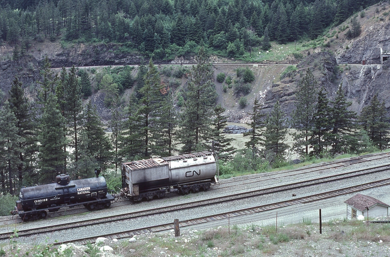 For those in the West / and who follow same


Summer season has Fire Fighting top of mind


two CN water canteens spotted on the back track near the Cisco bridges.


Near Lytton, May 12, 1980 Kodachrome by S.Danko


Noteworthy


water tank car: CN 80188 –  note the heater vent / stack


and a former Vanderbilt tender – roster number unknown - likely from  a CNR  steam loco, possible from a class U – 1 Mountain type, redeployed as a  a fire fighting tanker - fate unknown.


At another location nearby, a second Vanderbilt tender redeployed as a fire fighting tanker: roster number CN 80097 capacity 11,000 imperial gallons, fate unknown.  


 sdfourty