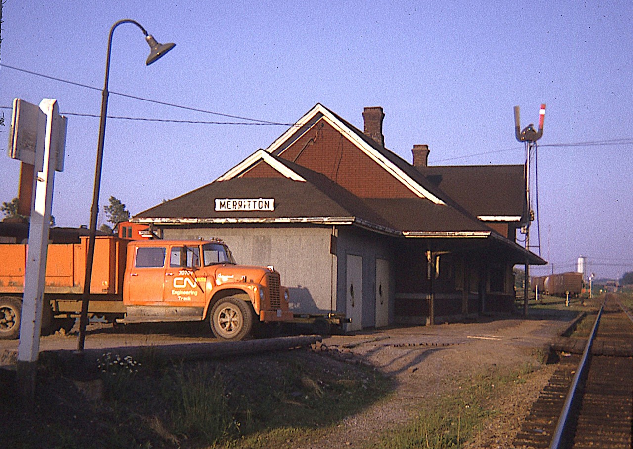 Here's another old image from the station files.  This is looking east on the Grimsby sub at Merritton. Note in the background the trestle connecting the Thorold sub is still in place. It was removed @ 1976, and the yard, of course is now gone. Station burned down in 1994, some 20 years after this image was shot..