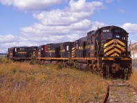 It has been nearly 13 years since I posted a shot of this trio dead at Sydney, Nova Scotia; with the 3716 in the lead.  I guess it is high time I posted from the OTHER end. :o) Here are CBNS 2016, 2003 and 3716 dormant in the afternoon sun, their lives on the CBNS over.
All units were sold in 2003, the pair of C-630M units were scrapped.