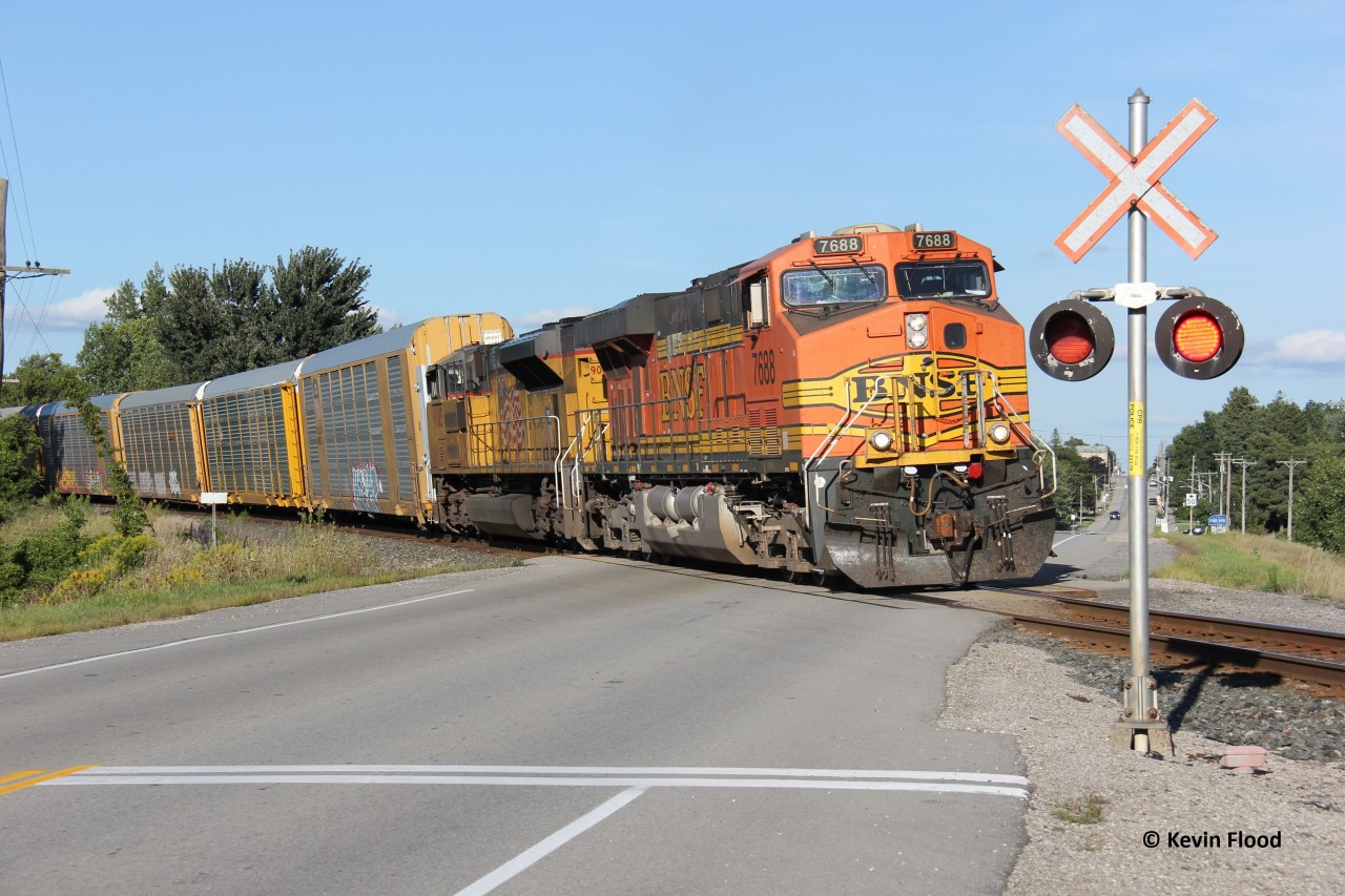 I have a few similar angles at this location, but I wanted to try one more. I also needed some US power for this shot; something not difficult to get on the Galt Sub. On the start of a gorgeous Saturday evening, an interesting turn of events unsurprising to the Galt Sub occurred. What I was expecting to be CPKC 137 with KCS 4775-UP 9045 (this was 137 from Toronto to Wolverton), turned out to be a 734 facing west with the KCS swapped for an H2 BNSF (#7688), which must have come in on a 734 earlier. Sometime soon after the original 137 arrived at Wolverton, there must have been some weird power swap because the 9045 trailed on this train and the KCS 4775 ended up staying as the 137 leader to London. My guess is that the 734 took 137's work at Wolverton, so both a train and power swap of sorts. This has happened before on the Galt, but this is another level! It never ceases to surprise me. So, here is a westbound 734 slowly departing Wolverton for London with BNSF 7688-UP 9045.