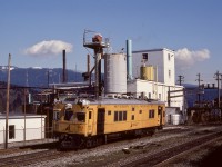 The bright yellow Sperry Rail Service rail inspection cars were always a camera treat, and on Tuesday 1982-03-16, SRS 123 was no exception as it slowly and steadily tested westward on the North track of CP’s Cascade sub. at mileage 119.2, past the Allied Chemicals (now Chemtrade Solutions) plant on the south shore of Burrard Inlet between Port Moody and Vancouver.