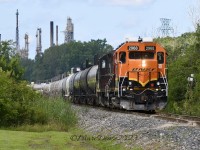 BNSF 2968 leads a cut of tankers back to CN Sarnia on the St. Clair Industrial Spur at Tashmoo Ave with the Suncor Refinery providing the back drop.