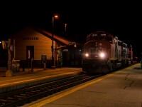 CN in Markham, a reunion 10 years in the making. 
After the YDHR shut its doors for the final time, ONR wanted their GP9 back and the crew of CN L546 was tasked with retrieving it from Lincolnville. CN 9555 and CN 9450 run up the Metrolinx Uxbridge sub light power to grab it, marking the first CN units to pass the historical Markham train station in 10 years, as far as I can tell. In 2014, CN ran a few work trains on the Uxbridge but since, only GO and ONR 1603 have passed the station. It's the wee hours of May 26th, nearly 01h30, yet nearly 10 railfans are out chasing this rare movement. 