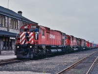 <br>
<br>
Crew Change
<br>
<br>
CP Rail #481 with MLW M-636 / C-630M / M-636 :  #4730 - 4503  - 4706 plus in tow GMD GP9 #8820  with  COFC
<br>
<br>
At CP Rail North Bay, Mile 117.3 North Bay Sub., Mile 0.0 Cartier Sub., May 21 1983 Kodachrome by S.Danko
<br>
<br>
And present, May 21, 1983,  at the CP Rail North Bay engine house
<br>
<br>
CP Rail RS-18 #8741; RS-18u #1814 (to NBEC by 1993); RDC-1 #90 ( ex CPR  # 9069) ; MLW S-3 #6594 ; MLW S-2  #7094.
<br>
<br>
More North Bay
<br>
<br>
     <a href="http://www.railpictures.ca/?attachment_id=  43538 ">  extra east  </a>
<br>
<br>
sdfourty