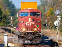 Autumn leaves are starting to appear as CPKC 114 hits the west end of Colborne.