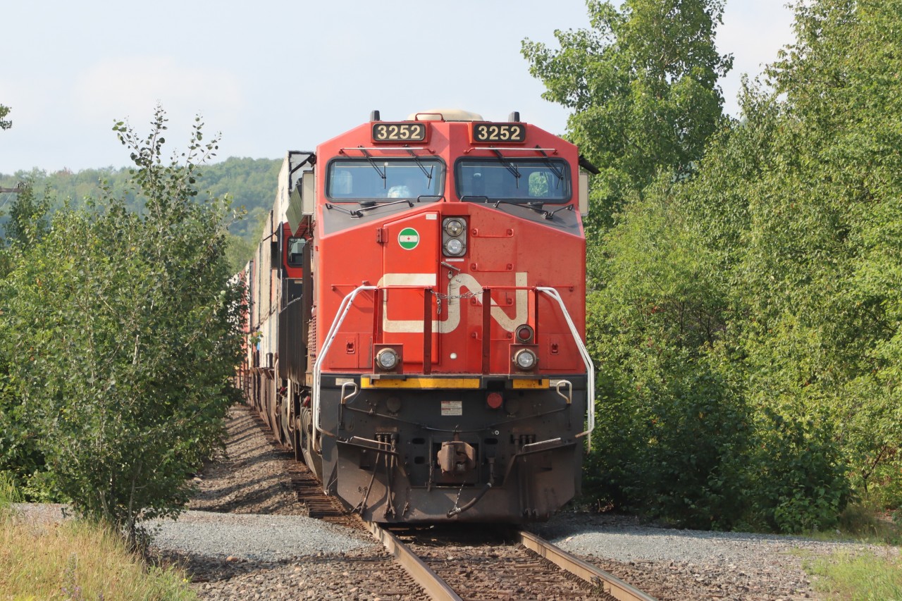 Sitting amongst the trees just south of Young St., Capreol waiting for the outbound crew to come on duty.