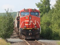 Sitting amongst the trees just south of Young St., Capreol waiting for the outbound crew to come on duty.


