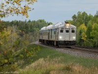 The almost daily flagstop run of Vias Budd cars highballs past Devon on the Nemegos sub returning from White River to Sudbury.