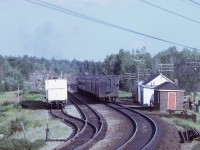 After meeting a westbound freight and making its station stop, CN train 676 with 6526 for power and steam generator car 15450 wearing the markers accelerates away from Laforest.  The clear signal at the east end of Laforest is clearly evident.  Lots of 1970ish railroad detail is evident in the photo including a work train in the back track.

A view of train 676 approaching can be viewed here: www.railpictures.ca/?attachment_id=45136
 