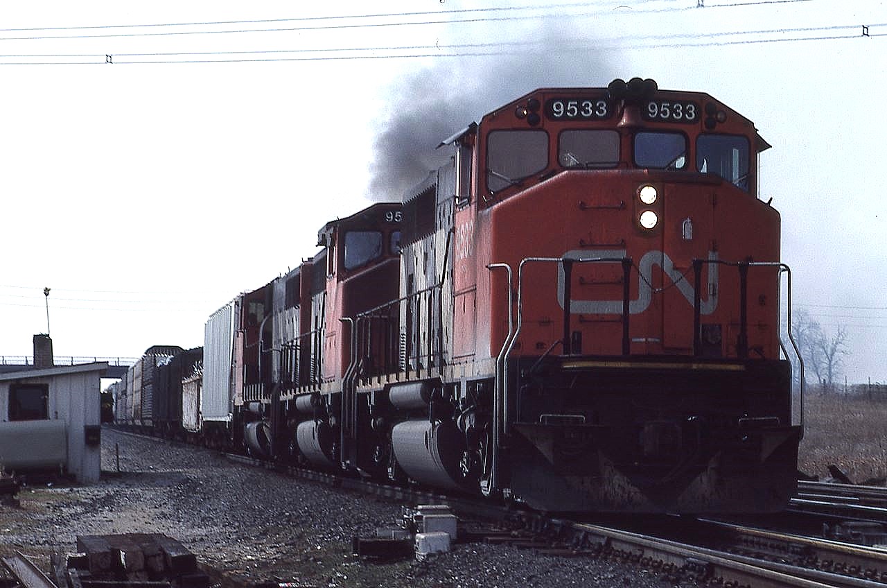 A trio of battle worn 9500s, lead by 9533, charge eastward out of MacMillan Yard Toronto, Ontario on a dull April afternoon.