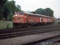 A matched A-B-A set of CP Rail F-units (FP7 4036, F7B 4432, and FP7 4063) leave their westbound train on the mainline as they switch cars at the west end of Galt Yard on a gloomy day.<br><br>By this point in time, the Alco/MLW and FM/CLC fleets of cowl units had been retired, leaving only the GMD fleet, which would soldier on until most of the passenger F-unit fleet was sold to VIA in 1978, and most of the remaining F-units in freight service were retired in the early 80's. <br><br><i>Bill McArthur photo, Dan Dell'Unto collection slide.</i>