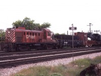 As I headed into CP's Agincourt Yard on Sunday June 5th, 1977, to see what there might be of interest, this auxiliary train with the 8428 was heading west.  Found the train near the west end of Lambton Yard as they were preparing to rerail a couple of wayward cars that had left the rails.