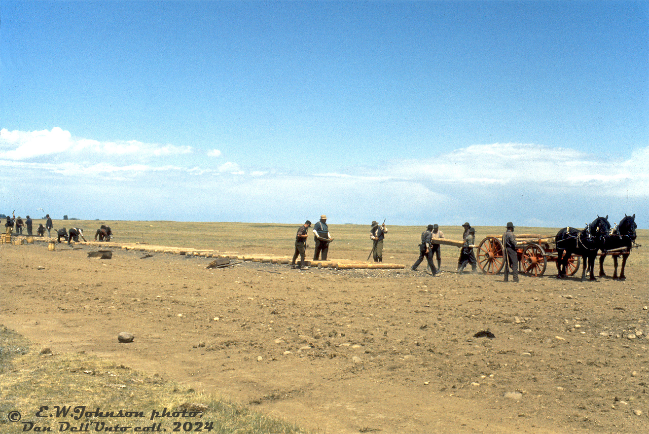 Hundreds of "navvies" labour over the prairies to lay Canada's new transcontinental railway, the Canadian Pacific, connecting eastern Canada to British Columbia. Using primative hand tools, horses and carts, and good old fashioned manual labour, they toil on to met Van Horne's goal of laying 500 miles of track across the prairies in the single season during the Summer of 1882 (spoiler: they only got 417 miles laid due to the weather).

This would have been the story in the 1880's, but this photo was actually taken in 1973 during the CBC's filming of Pierre Berton's "The National Dream", documenting the story of laying Canada's transcontinental railway from sea to sea. Difficult conditions in the mountains, hot prairies, and rocky northern Ontario "Canadian Shield" mixed with political and monitary difficulties made the construction a feat of its own.

According to a source on the matter, the track-laying filming scenes here were done on CP's Cassils Subdivision between Miles 9 and 9.5, on the curve approaching Kitsum, Alberta (unsure of exact geolocation on map).

Eric. W. Johnson photo, Dan Dell'Unto collection slide.