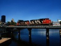 CN 500 is leaving the Port of Montreal, with a cruise ship docked in the background.