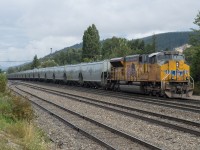 UP 3063 brings up the rear of CPKC 301 as it blasts through Golden British Columbia.