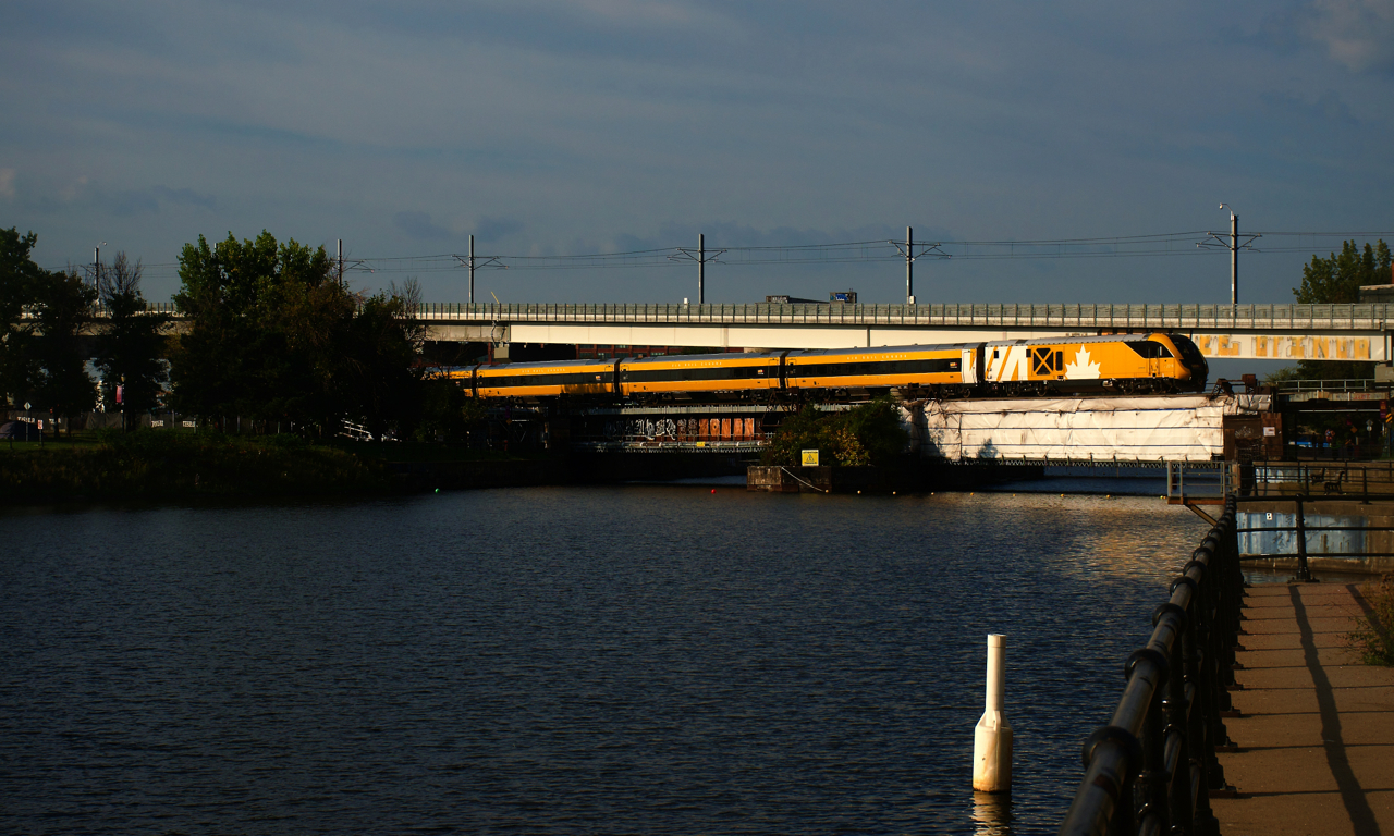 VIA 33 is crossing the Lachine Canal with the one of a kind Lumi consist.