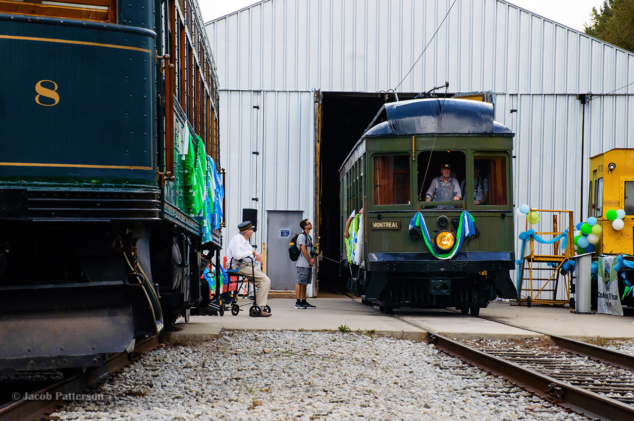 Multiple generations of volunteers at the Halton County Radial Railway take in the scene as Montreal & Southern Counties interurban car 107 prepares to depart towards the east loop, passing London & Port Stanley interurban car 108.  The afternoon of Saturday, September 21 saw the Ontario Electric Railway Historical Association celebrate the 70th anniversary of the museum.  What started with 8 railfans saving two street cars in the woods just south of Rockwood has grown into one of the largest operating museums in Canada through seven decades of dedicated volunteers.