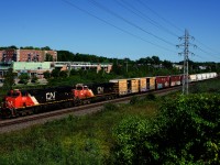 CN 369 has an ES44AC and a faded ES44DC for power as it heads west.