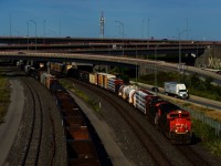 A short CN 401 (210 axles) is about to be overtaken by VIA 69, as CN 321 is seen at the left.