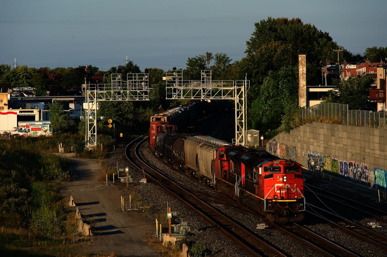 It's about an hour after sunrise as CN 322 heads east with two SD70M-2s up front and a Dash9 mid-train. After setting off cars at Taschereau Yard, it is heading to its terminus of Southwark Yard.